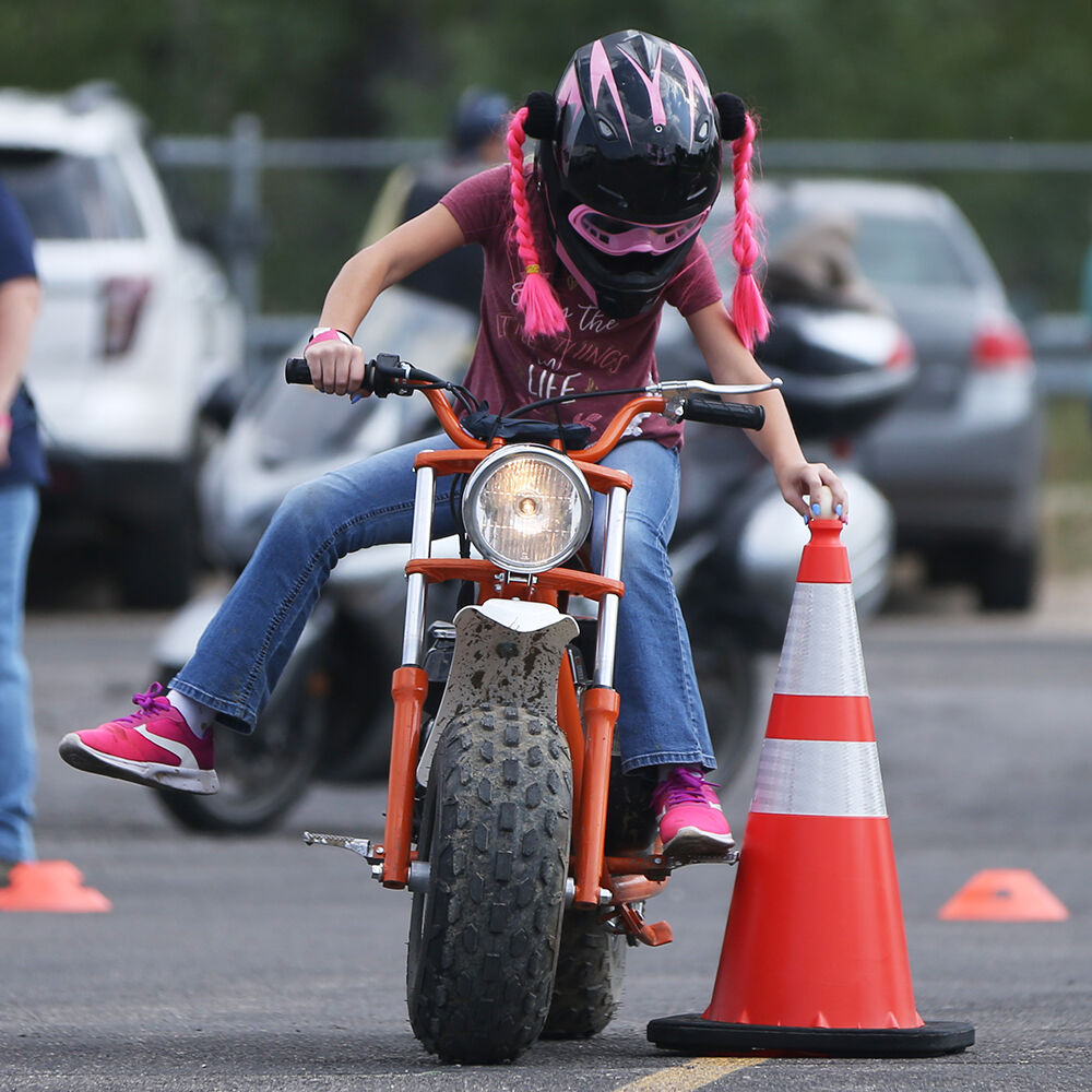 AngelLyna Smith, 12, reaches and snags her egg off of a cone